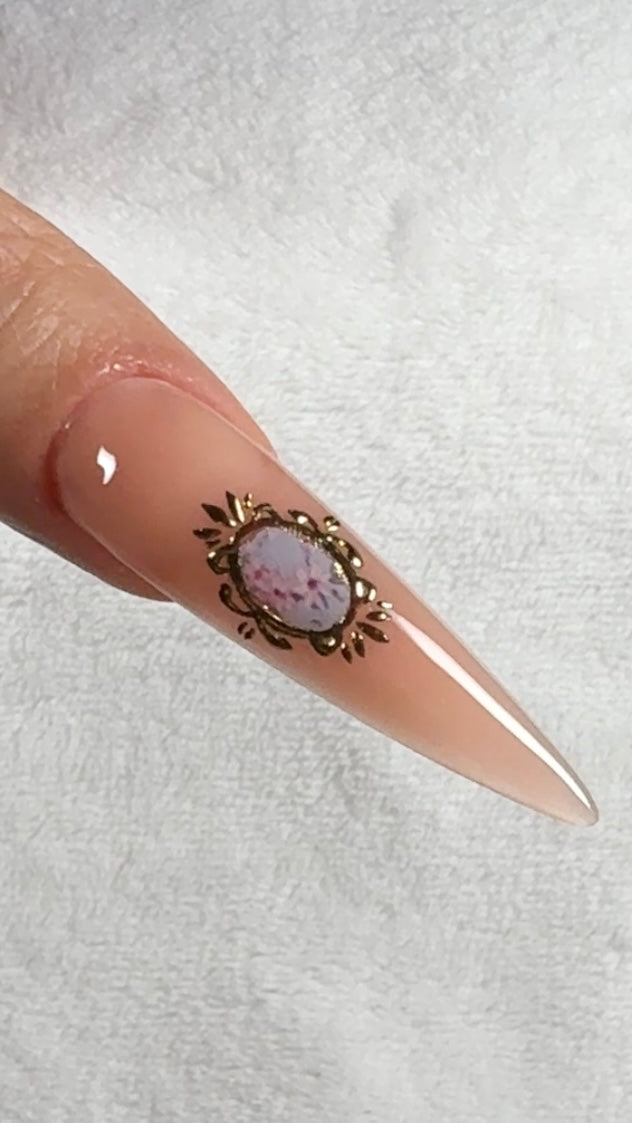 Nail with decorative design on a light background